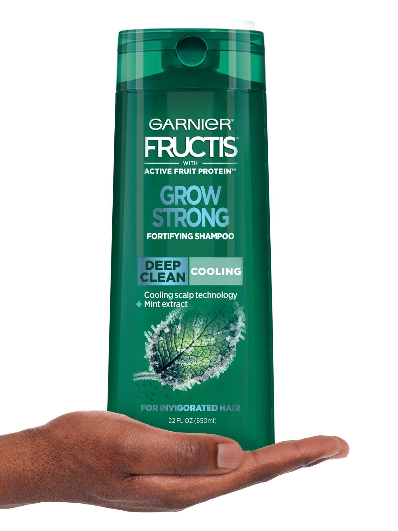 Hand holding Cooling Deep Clean Shampoo for Men for Invigorated Hair.